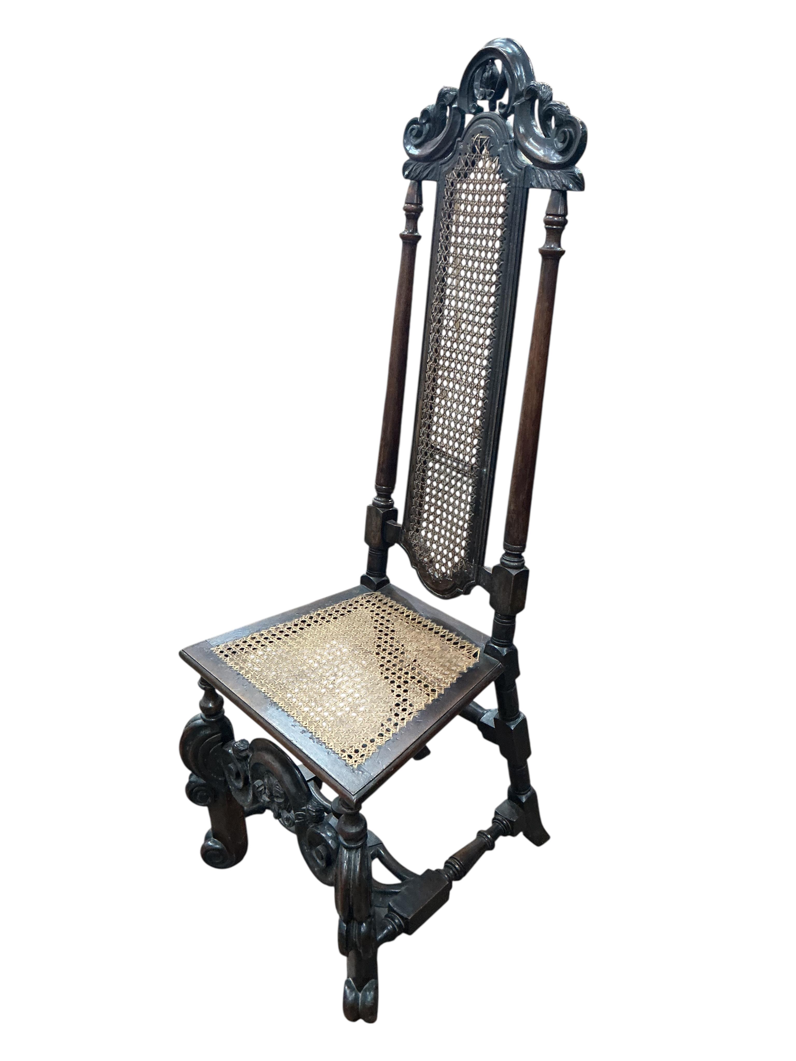 A pair of William and Mary walnut and cane work side chairs, width 46cm, depth 48cm, height 116cm